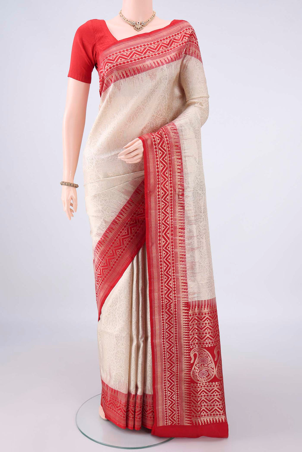 Pure Silk Off White Soft Saree with Zari Brocade on the body and Zari Border.  displayed on a mannequin