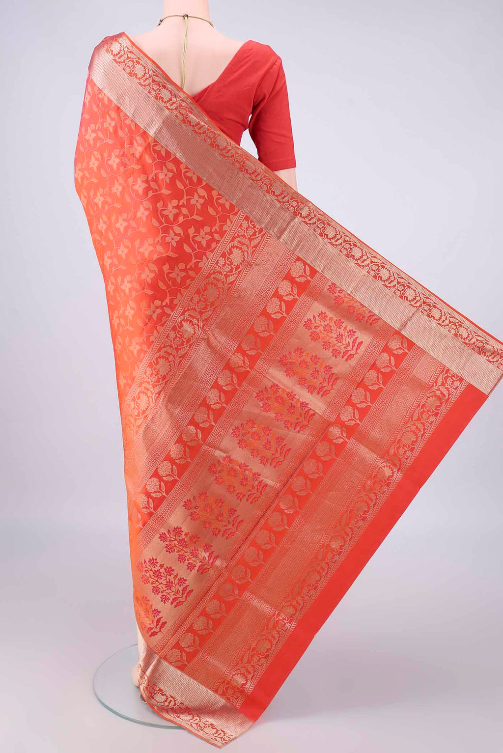 Flat view of Pure Silk Brick Orange Soft Saree with Zari Brocade on the body and Zari Border. 