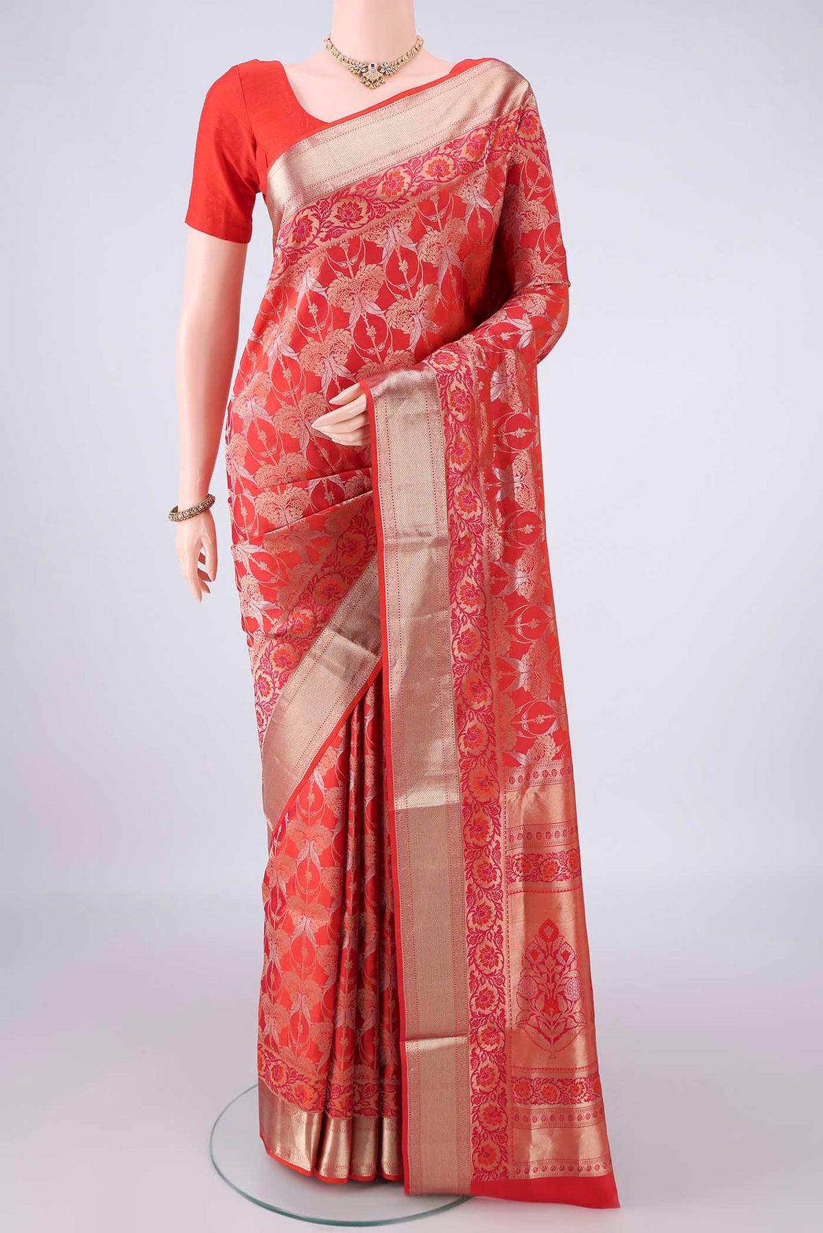 Pure Silk Brick Orange Dual Tone Soft Saree with Zari Brocade on the body and Zari Border.  displayed on a mannequin
