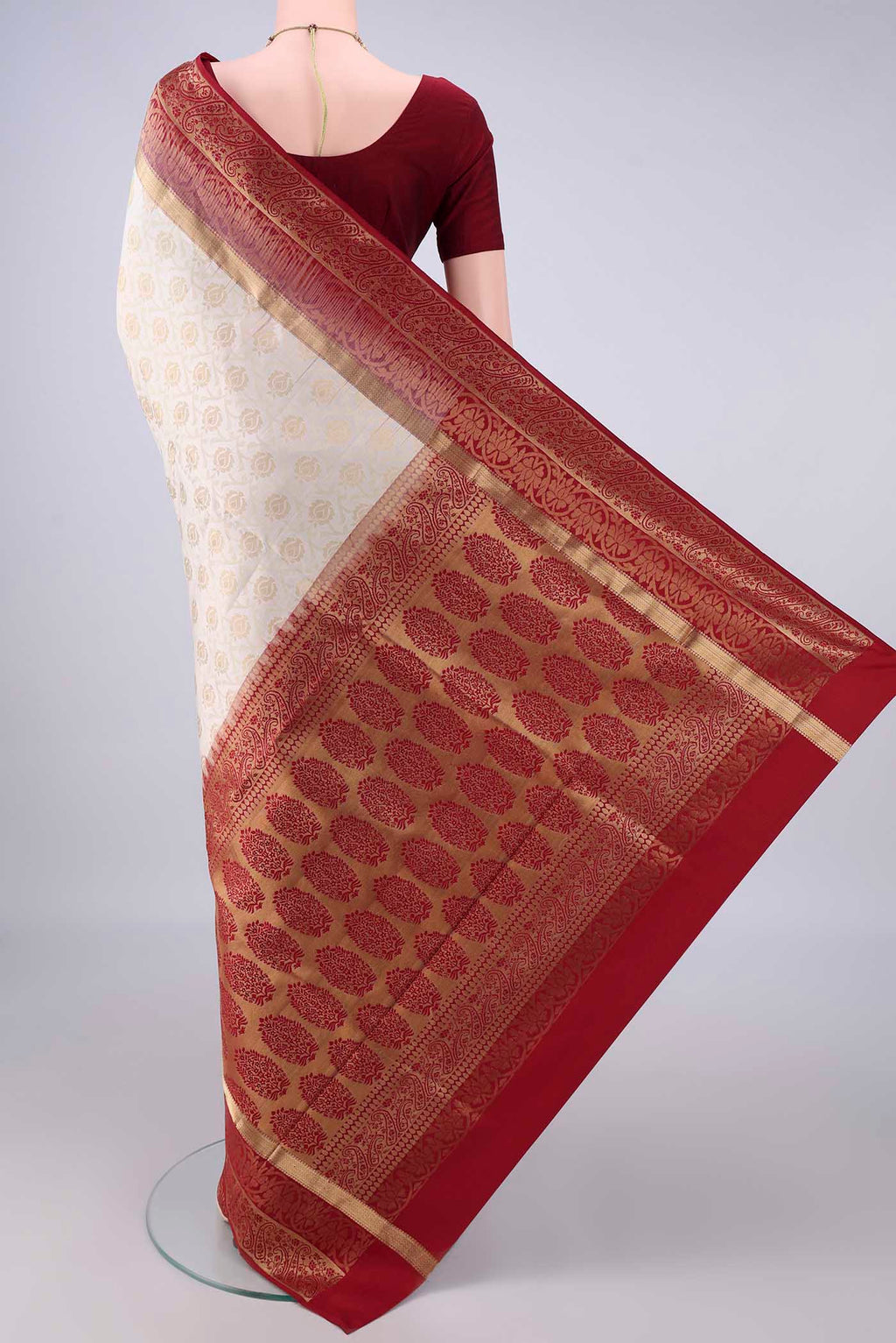 Flat view of Pure Silk White Soft Saree with Zari Brocade on the body and Zari Border. 
