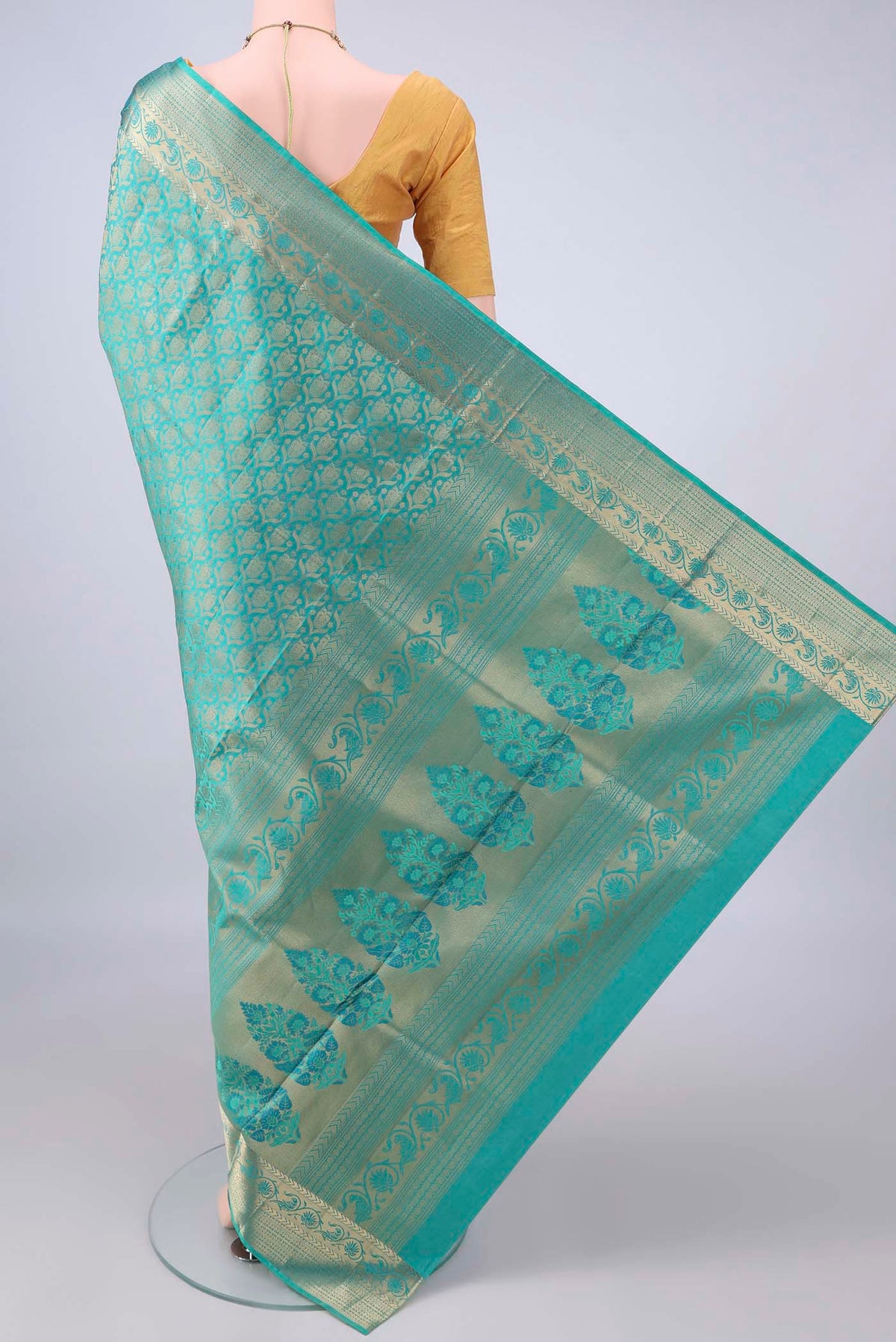 Flat view of Pure Silk Turquoise Soft Saree with Zari Brocade on the body and Zari Border. 