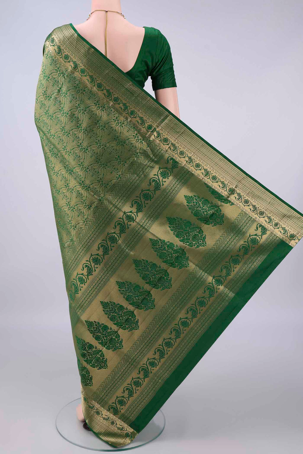Flat view of Pure Silk Bottle Green Soft Saree with Zari Brocade on the body and Zari Border. 