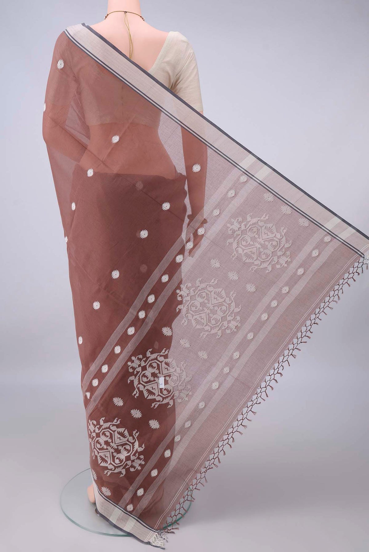 Flat view of Brown Bengal Cotton Saree with Thread Butta on the body and Plain Border. 
