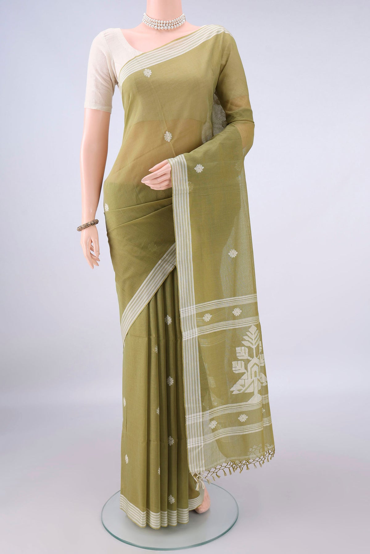 Light Green Bengal Cotton Saree with Thread Butta on the body and Plain Border.  displayed on a mannequin