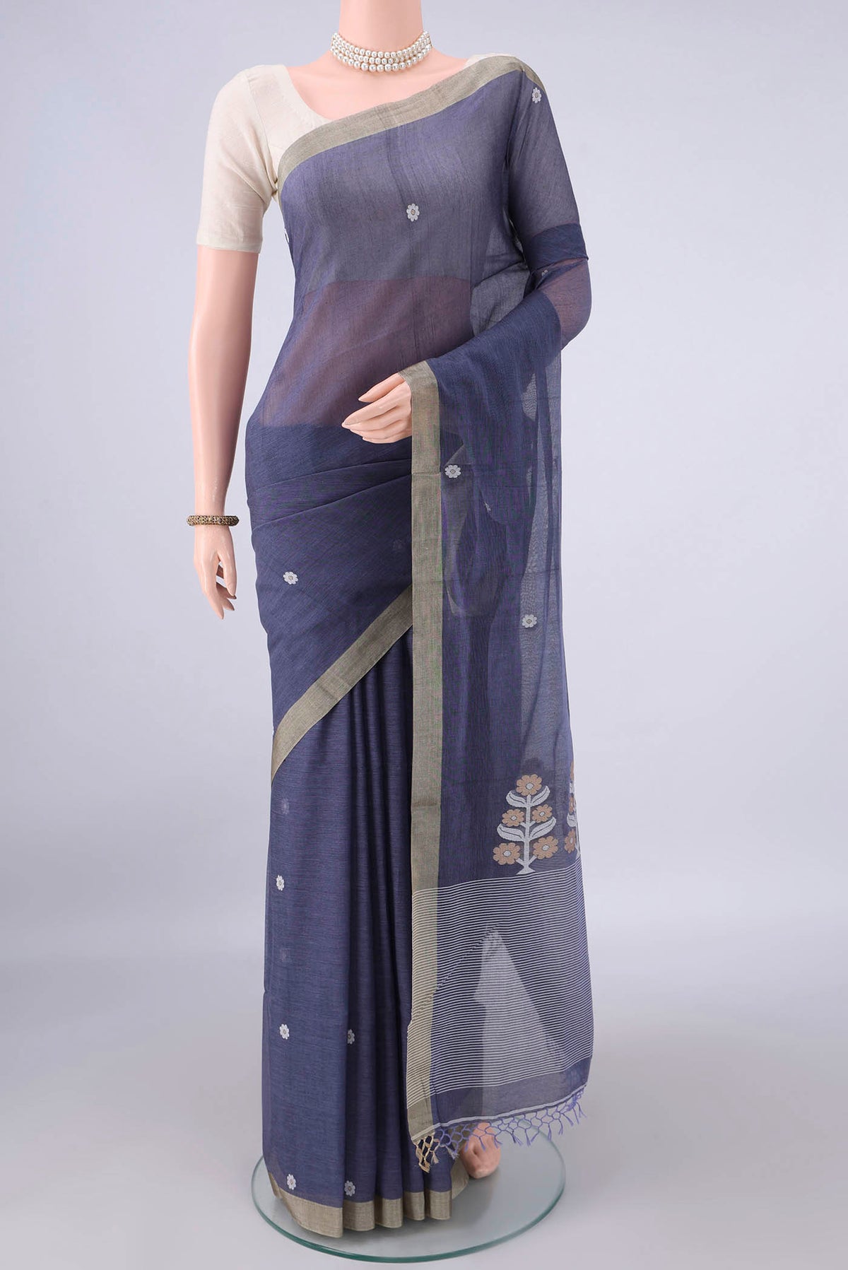 Blue Grey Bengal Cotton Saree with Thread Butta on the body and Plain Border.  displayed on a mannequin