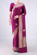 Magenta Banarasi Saree with Zari Butta on the body and Zari Border.  displayed on a mannequin