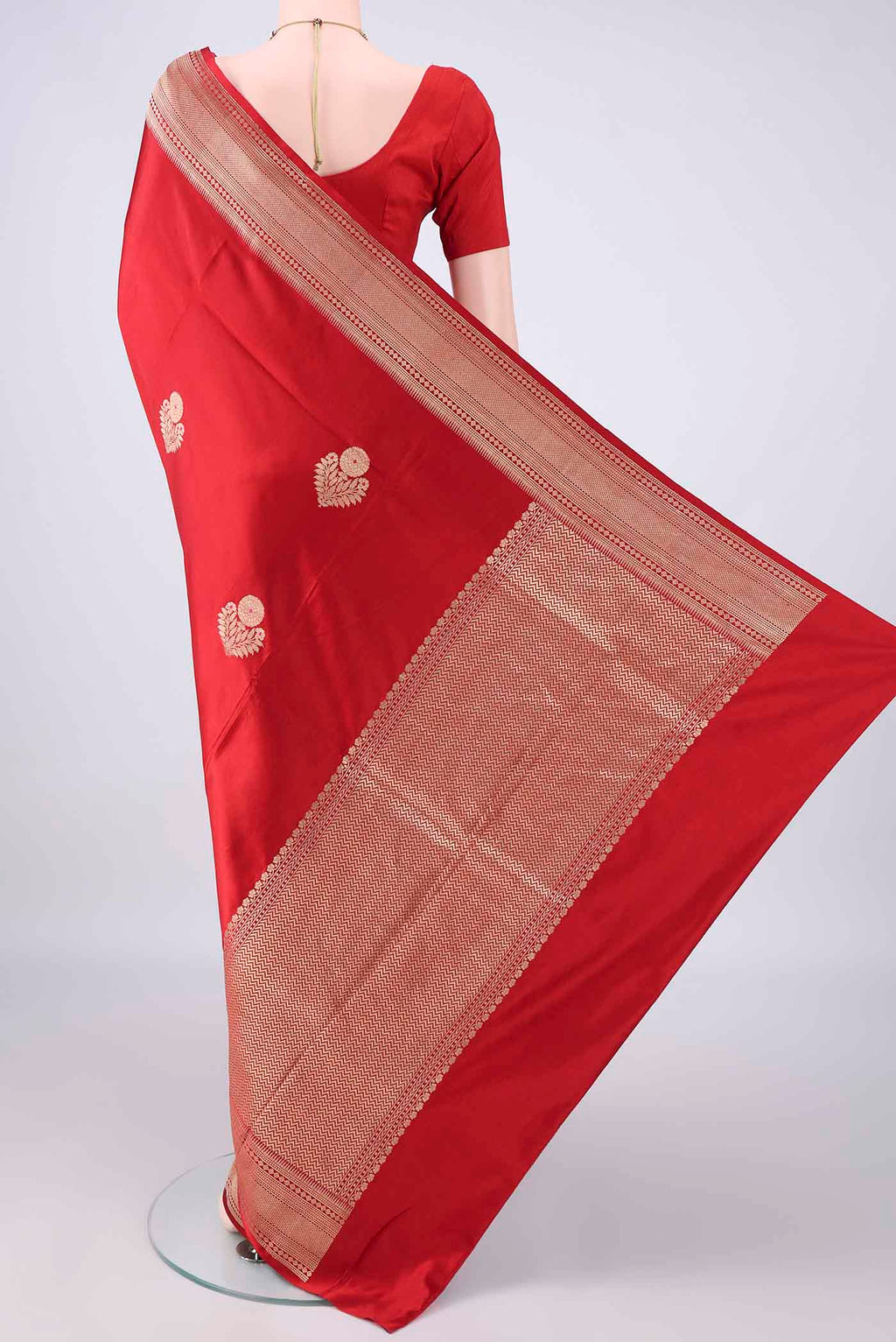 Flat view of Red Banarasi Saree with Zari Butta on the body and Zari Border. 