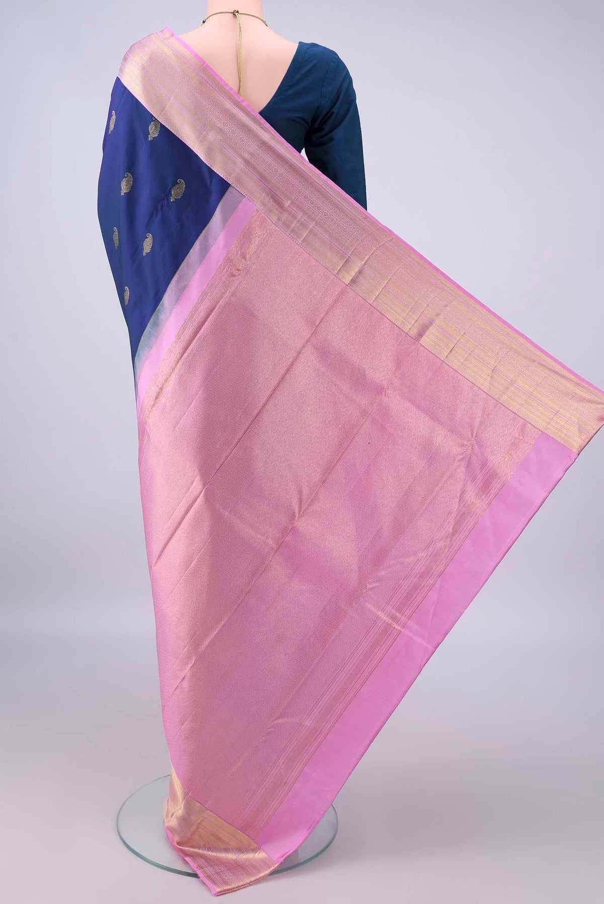Flat view of Pure Silk Navy Blue Kanchipuram Saree with Zari Butta on the body and Zari Border. 
