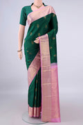 Pure Silk Bottle Green Kanchipuram Saree with Zari Butta on the body and Zari Border.  displayed on a mannequin