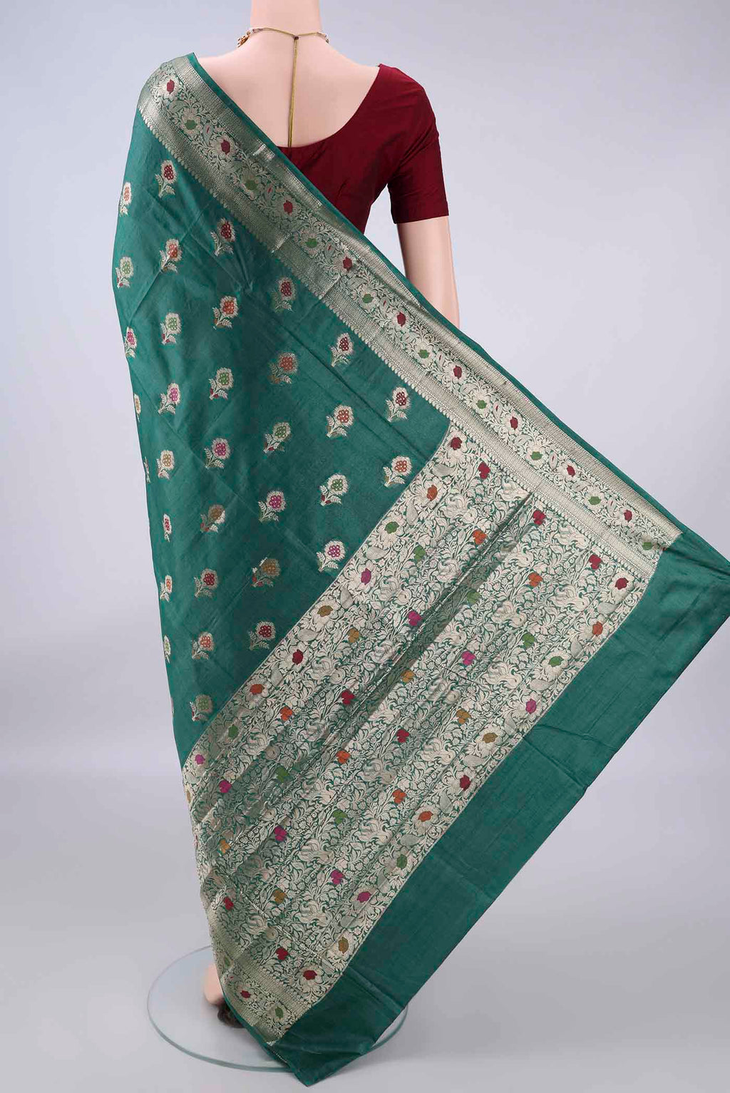 Flat view of Green Banarasi Tussar Saree with Zari And Thread Butta on the body and Zari And Thread Border. 