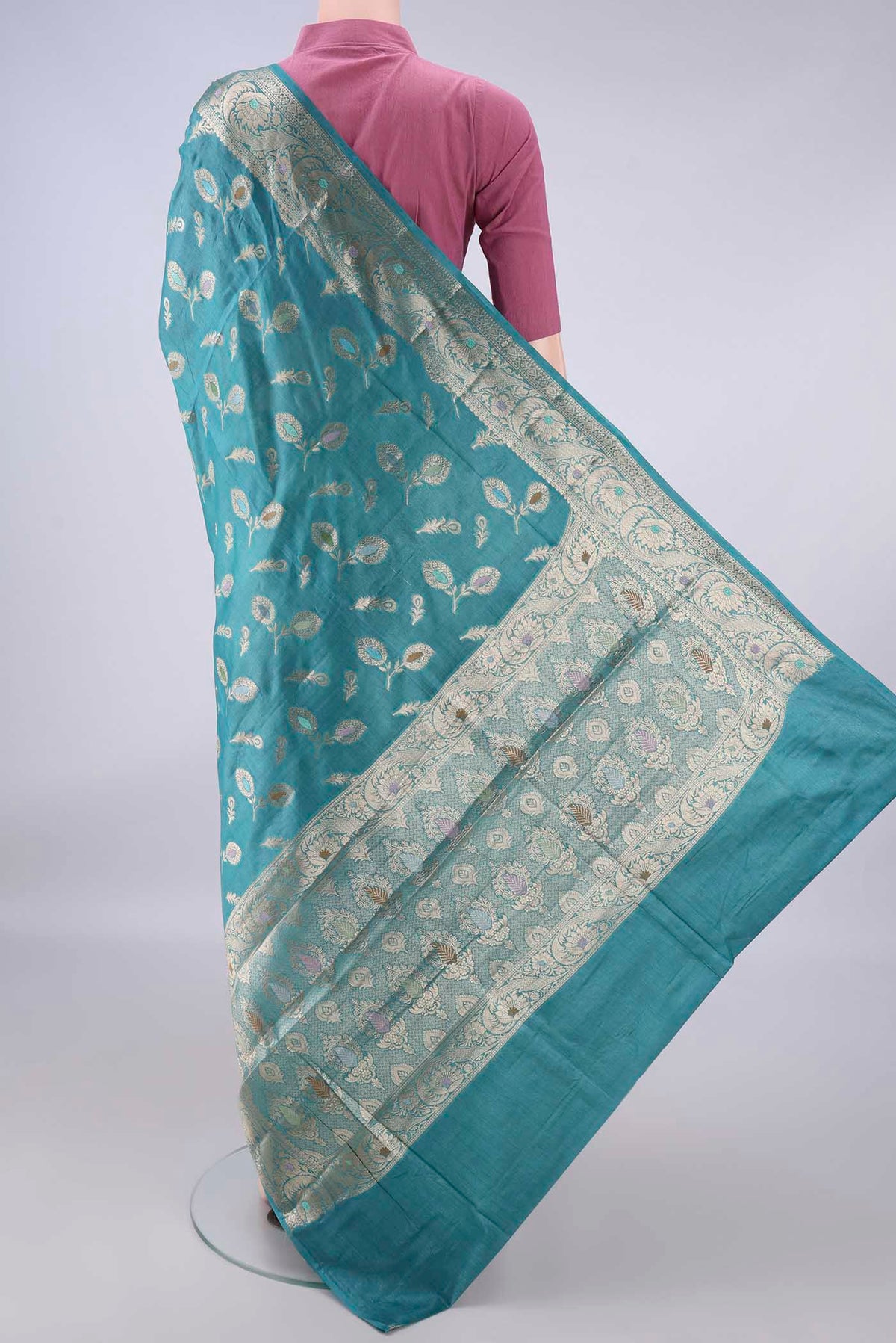 Flat view of Green Banarasi Raw Saree with Zari And Thread Butta on the body and Zari And Thread Border. 