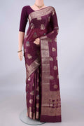 Burgundy Banarasi Tussar Saree with Zari Butta on the body and Zari And Thread Border.  displayed on a mannequin