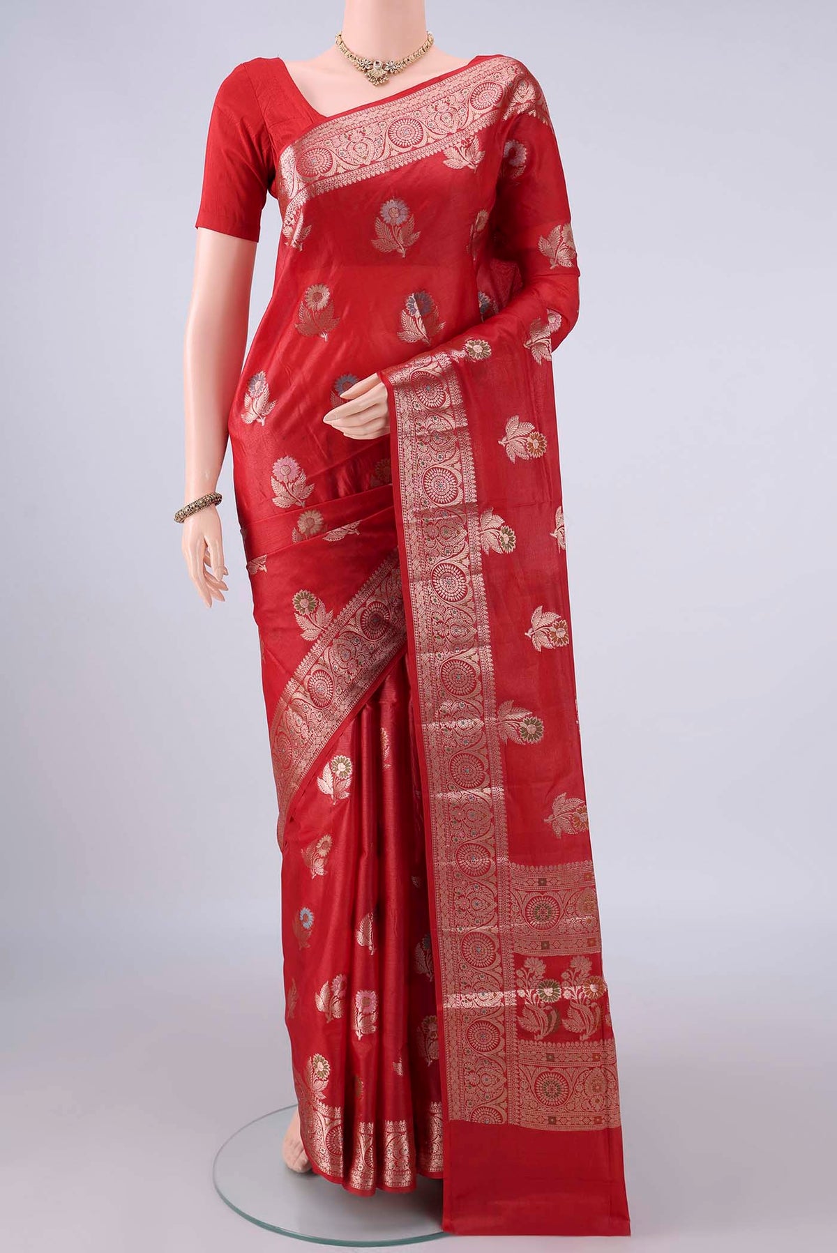 Red Banarasi Tussar Saree with Zari And Thread Butta on the body and Zari And Thread Border.  displayed on a mannequin