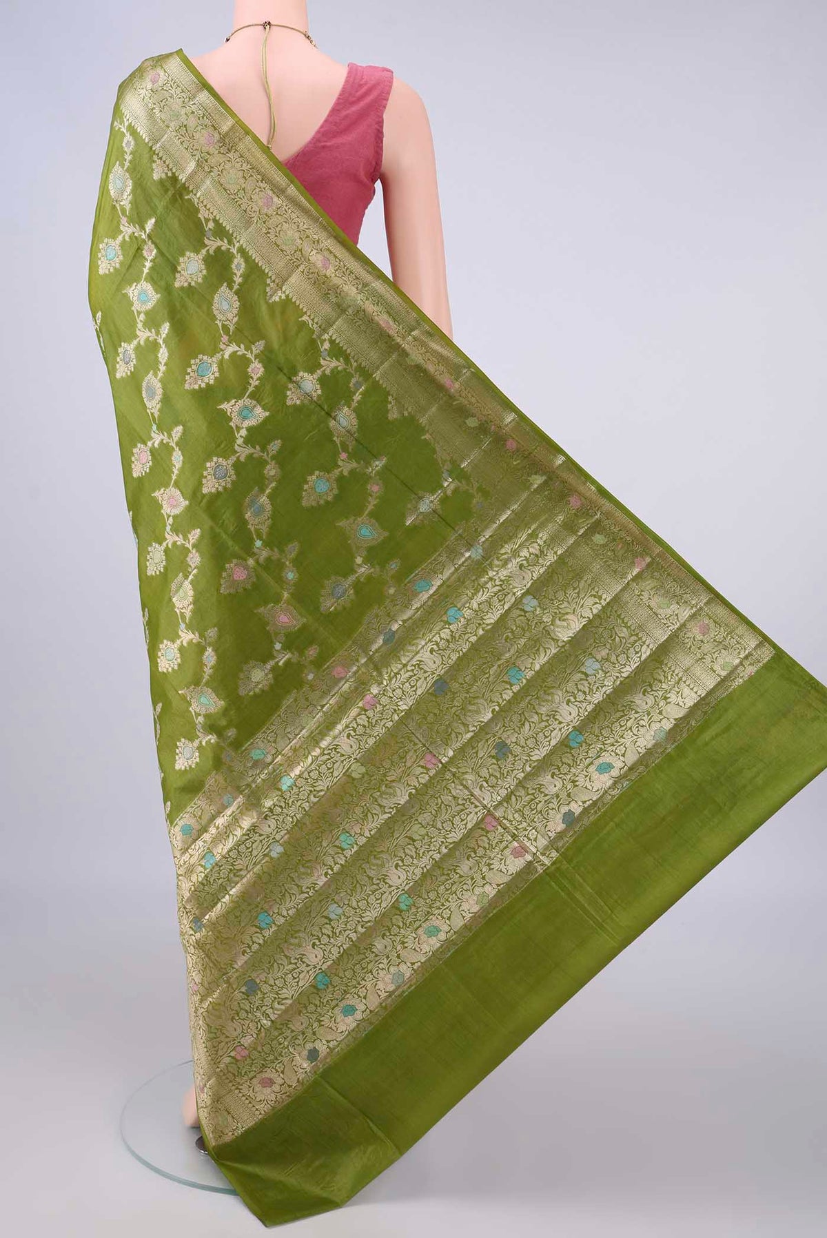 Flat view of Light Green Banarasi Tussar Saree with Zari And Thread Butta on the body and Zari And Thread Border. 