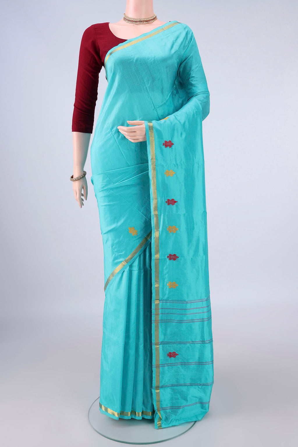 Pure Silk Sky Blue Kanchipuram Saree with Plain Body and Zari And Thread Border.  displayed on a mannequin
