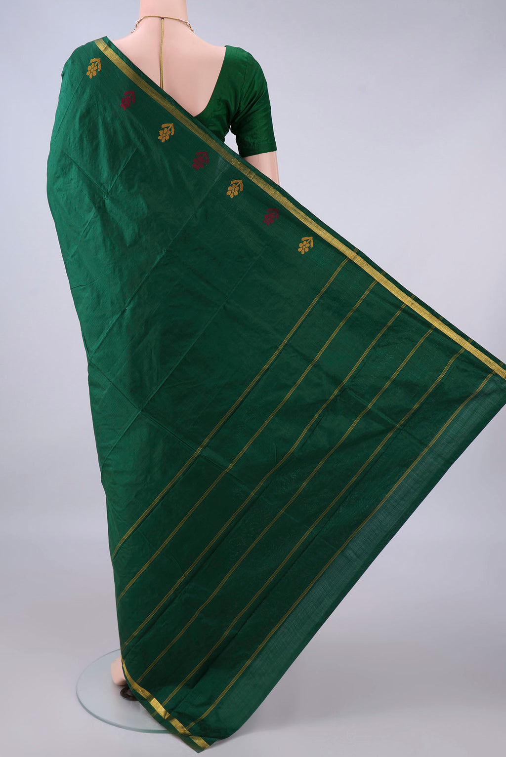 Flat view of Pure Silk Bottle Green Kanchipuram Saree with Plain Body and Zari Border. 