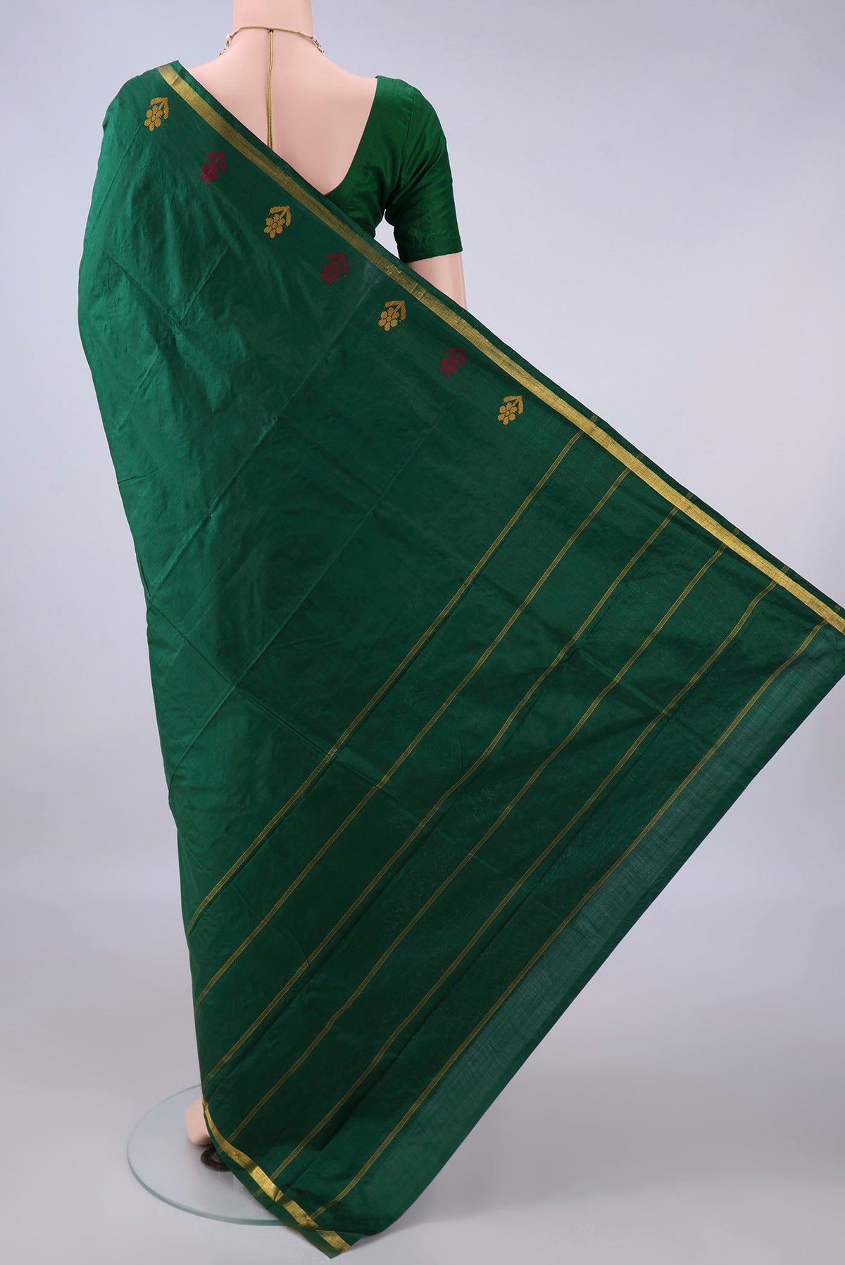 Flat view of Pure Silk Bottle Green Kanchipuram Saree with Plain Body and Zari Border. 