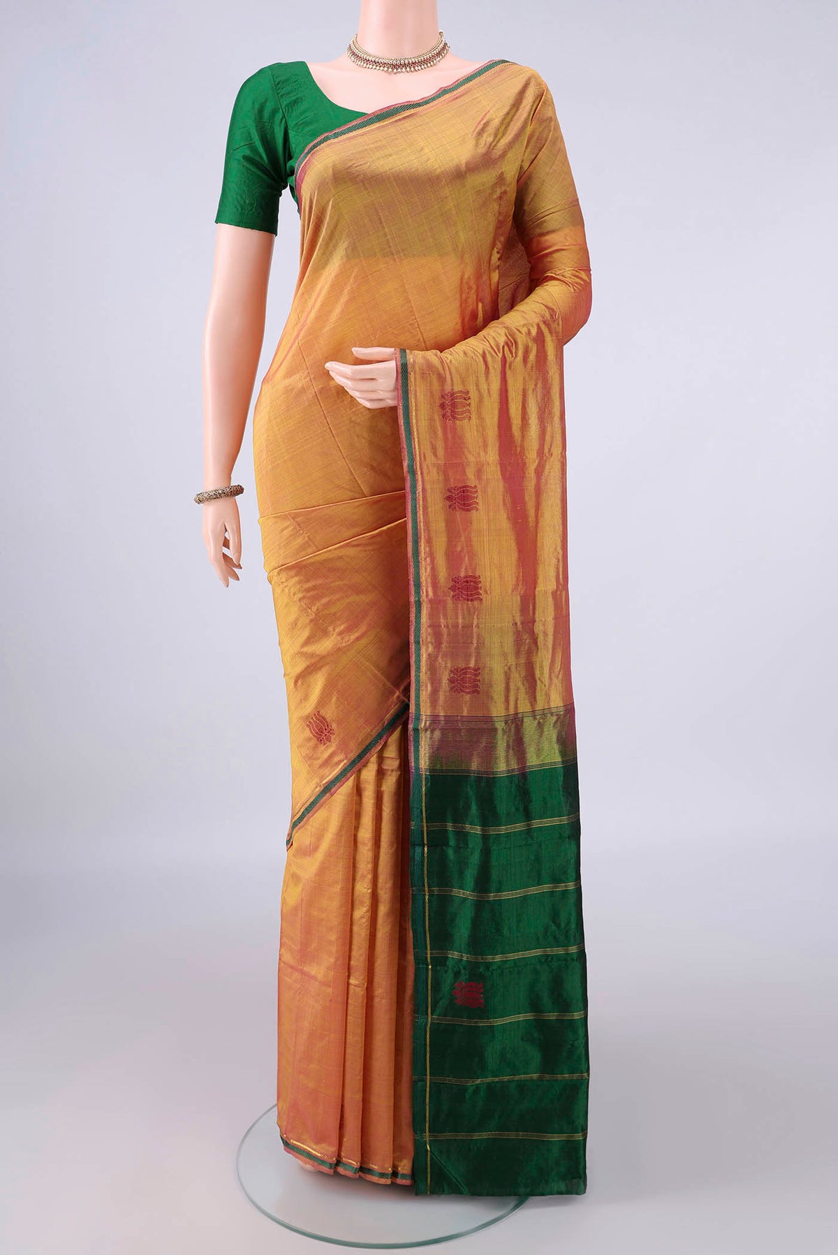 Pure Silk Mustard Kanchipuram Saree with Plain Body and Zari Border.  displayed on a mannequin