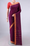 Magenta Blended Bangalore Silk Saree with Plain Body and Zari Border.  displayed on a mannequin