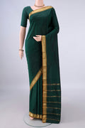Bottle Green Blended Bangalore Silk Saree with Plain Body and Zari Border.  displayed on a mannequin