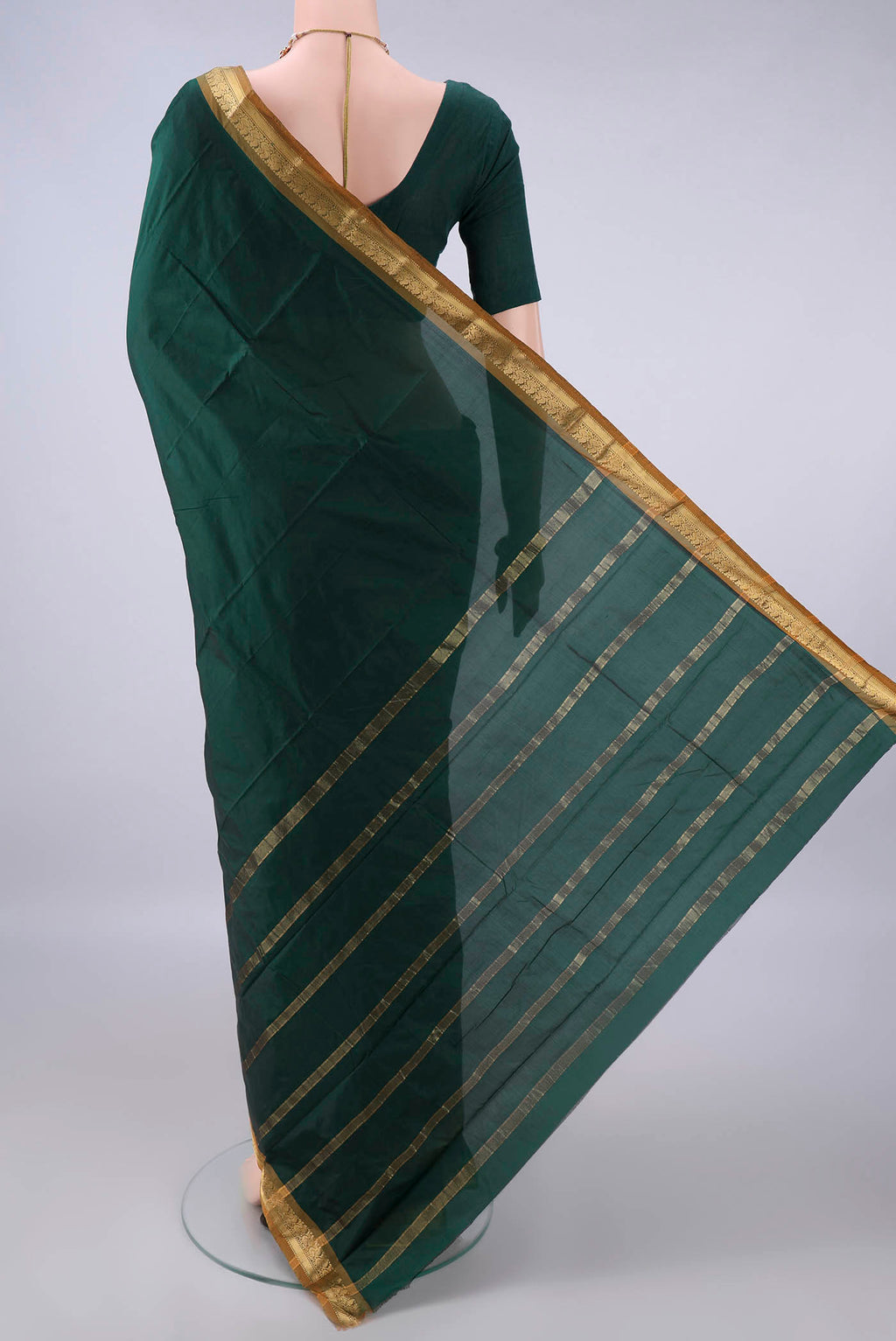 Flat view of Bottle Green Blended Bangalore Silk Saree with Plain Body and Zari Border. 
