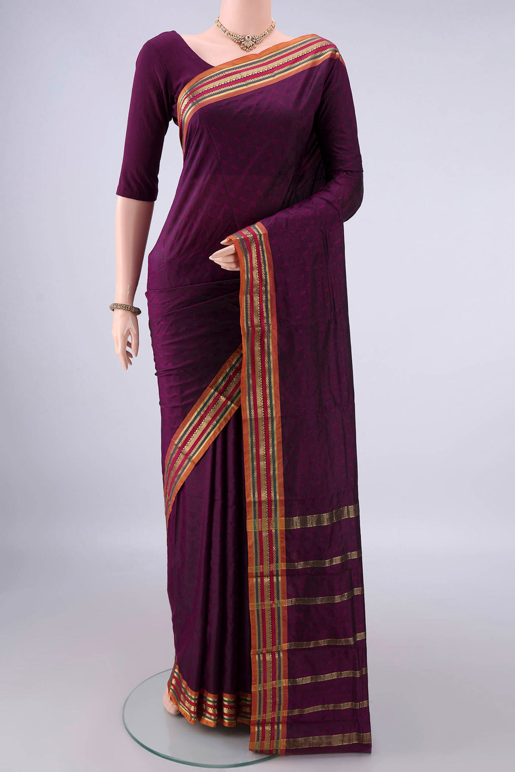 Burgundy Blended Bangalore Silk Saree with Jacquard design on the body and Zari Border.  displayed on a mannequin