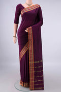 Burgundy Blended Bangalore Silk Saree with Jacquard design on the body and Zari Border.  displayed on a mannequin