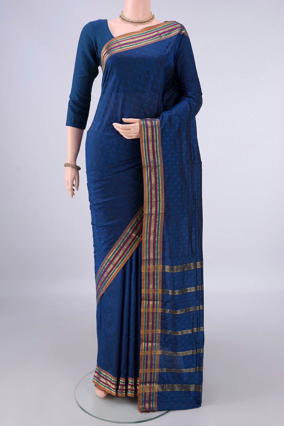 Blue Blended Bangalore Silk Saree with Jacquard design on the body and Zari Border.  displayed on a mannequin