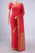 Brick Orange Blended Bangalore Silk Saree with Jacquard design on the body and Zari Border.  displayed on a mannequin