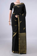 Pure Silk Black Kanchipuram Saree with Zari Butta on the body and Zari Border.  displayed on a mannequin