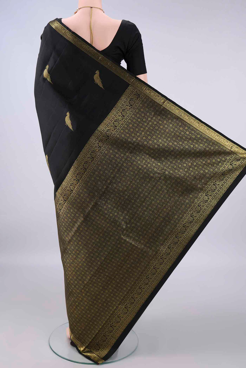 Flat view of Pure Silk Black Kanchipuram Saree with Zari Butta on the body and Zari Border. 