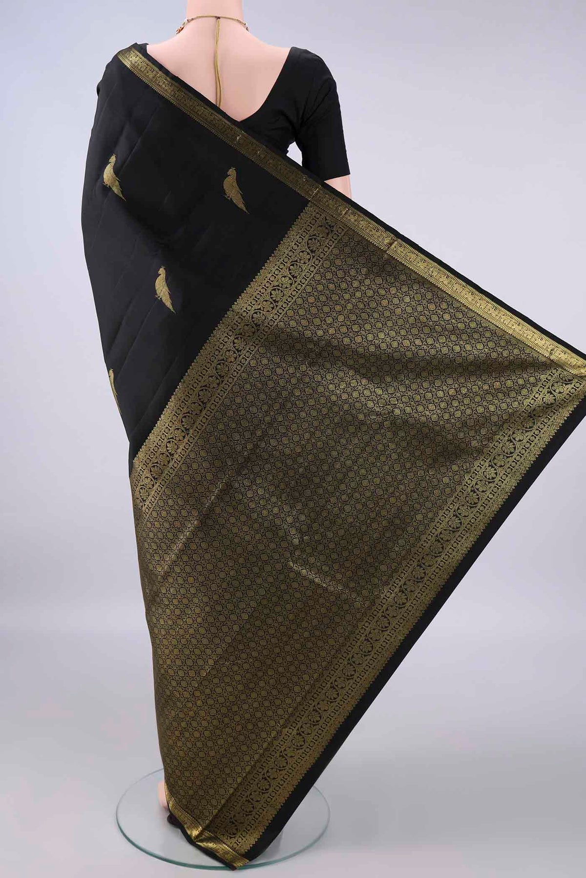 Flat view of Pure Silk Black Kanchipuram Saree with Zari Butta on the body and Zari Border. 