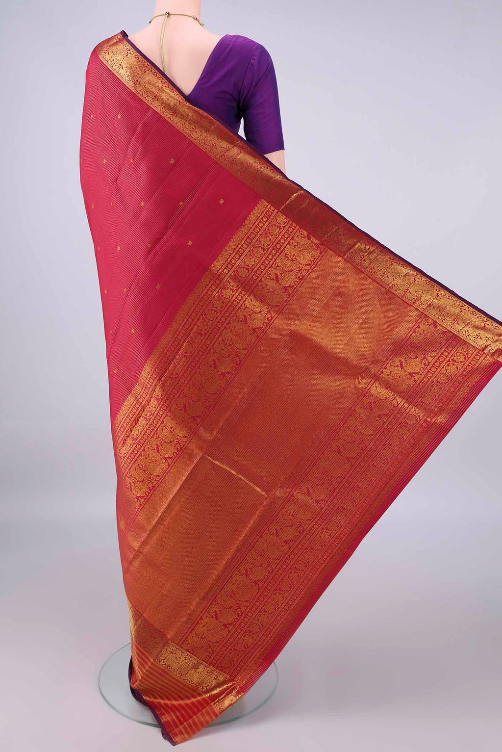 Flat view of Pure Silk Red Kanjivaram Saree with Zari Butta on the body and Zari Border. 