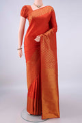 Pure Silk Rust Dual Tone Kanjivaram Saree with Plain Body and Zari Border.  displayed on a mannequin