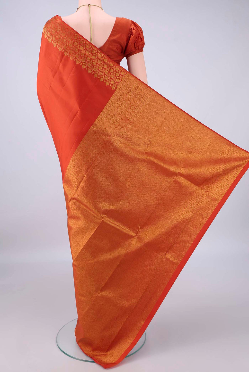Flat view of Pure Silk Rust Dual Tone Kanjivaram Saree with Plain Body and Zari Border. 