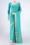 Turquoise Mysore Crepe Saree with Plain Body and Zari Border.  displayed on a mannequin
