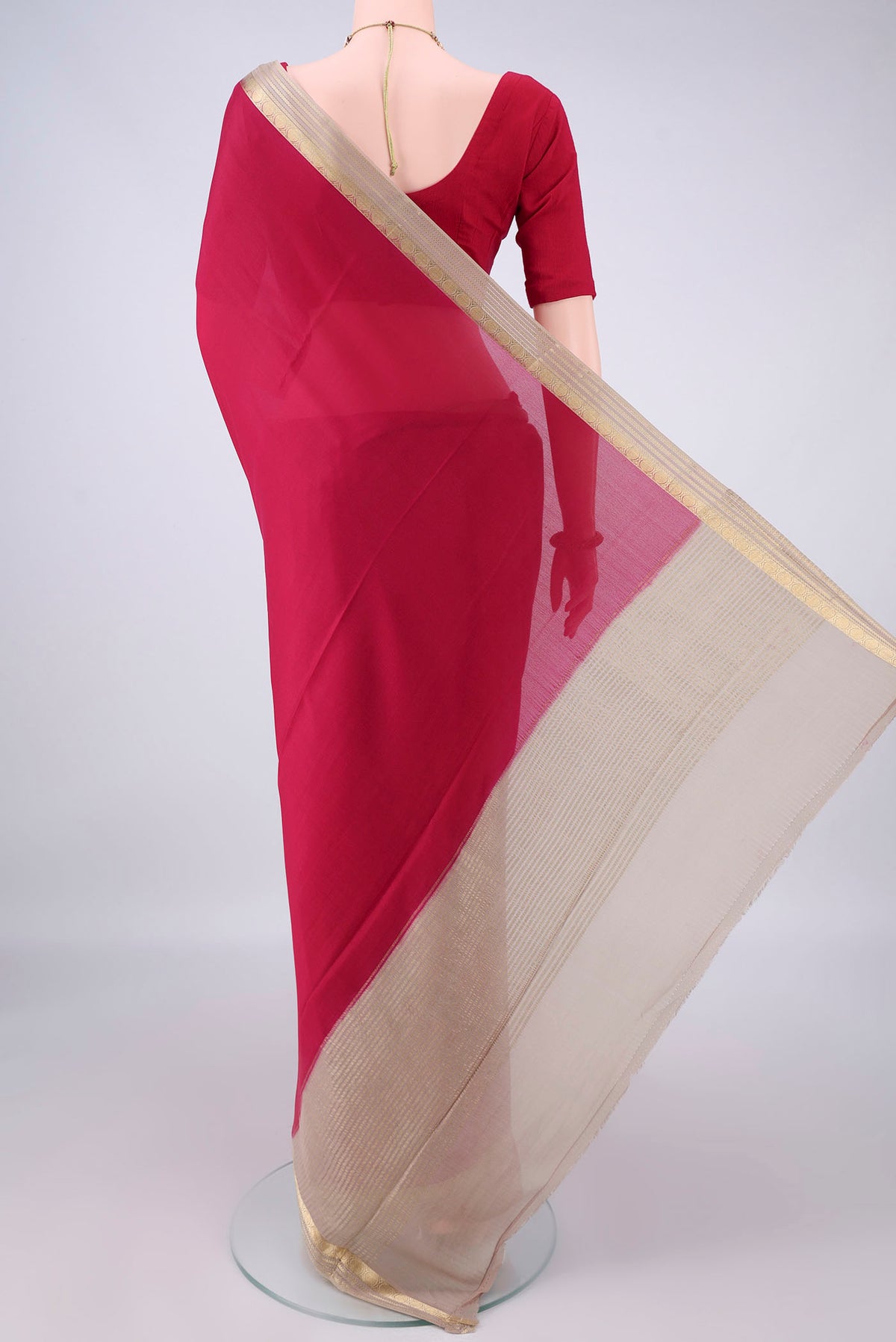 Flat view of Deep Red Mysore Crepe Saree with Plain Body and Zari Border. 
