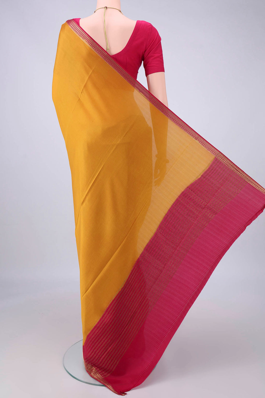 Flat view of Mustard Mysore Crepe Saree with Plain Body and Zari Border. 