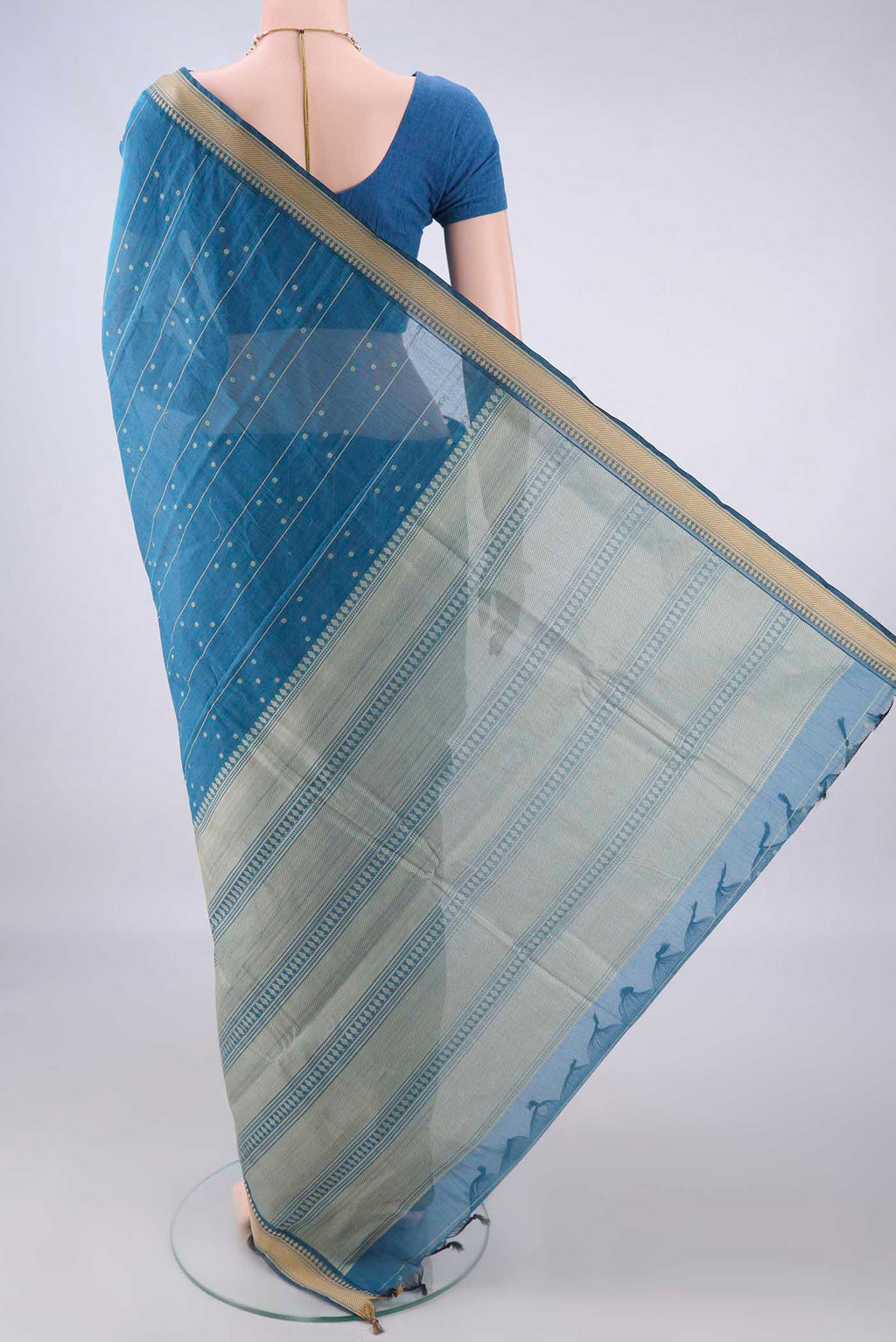 Flat view of Blue Kanchi Cotton Saree with Stripes on the body and Thread Border. 