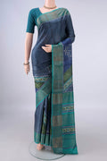 Davys Grey Tussar Saree with Printed design on the body and Zari Border.  displayed on a mannequin