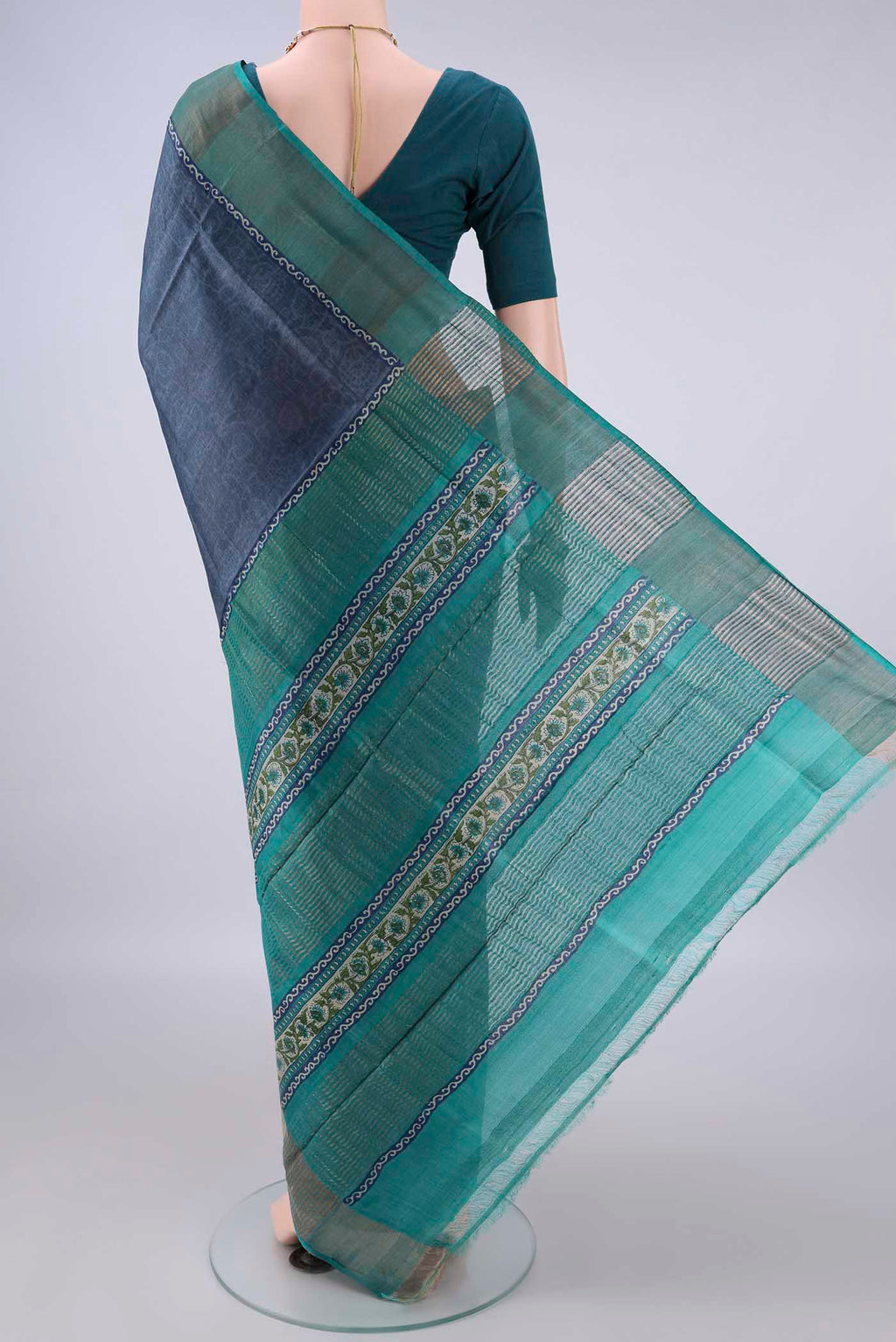 Flat view of Davys Grey Tussar Saree with Printed design on the body and Zari Border. 