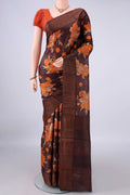 Brown Tussar Saree with Floral Print on the body and Zari Border.  displayed on a mannequin