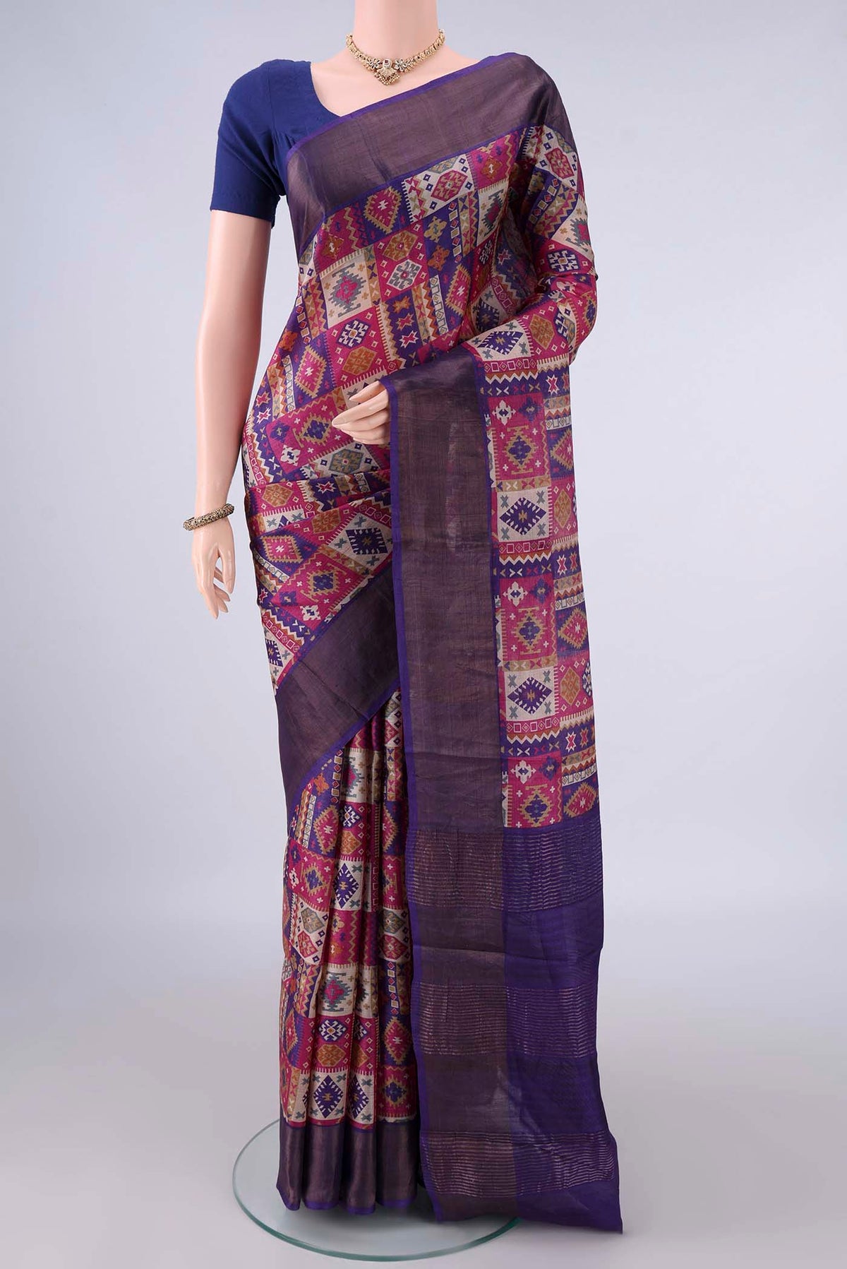 Blue Tussar Saree with Printed design on the body and Zari Border.  displayed on a mannequin