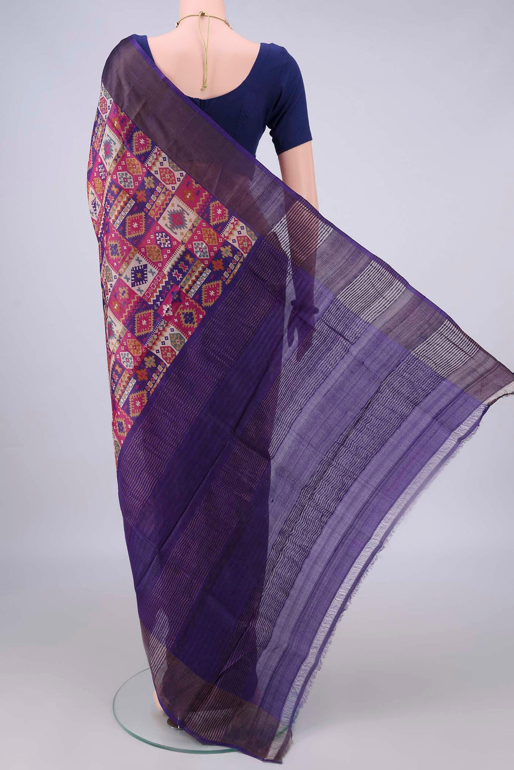 Flat view of Blue Tussar Saree with Printed design on the body and Zari Border. 