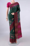 Bottle Green Tussar Saree with Printed design on the body and Zari Border.  displayed on a mannequin