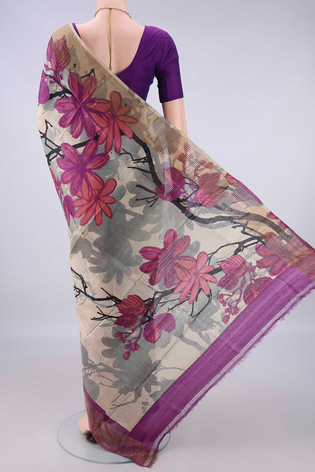 Flat view of Beige Tussar Saree with Printed design on the body and Zari Border. 