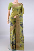 Light Green Tussar Saree with Printed design on the body and Zari Border.  displayed on a mannequin