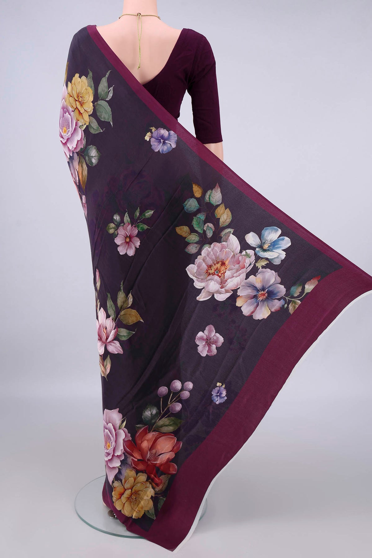 Flat view of Burgundy Crepe Saree with Printed design on the body and Plain Border. 