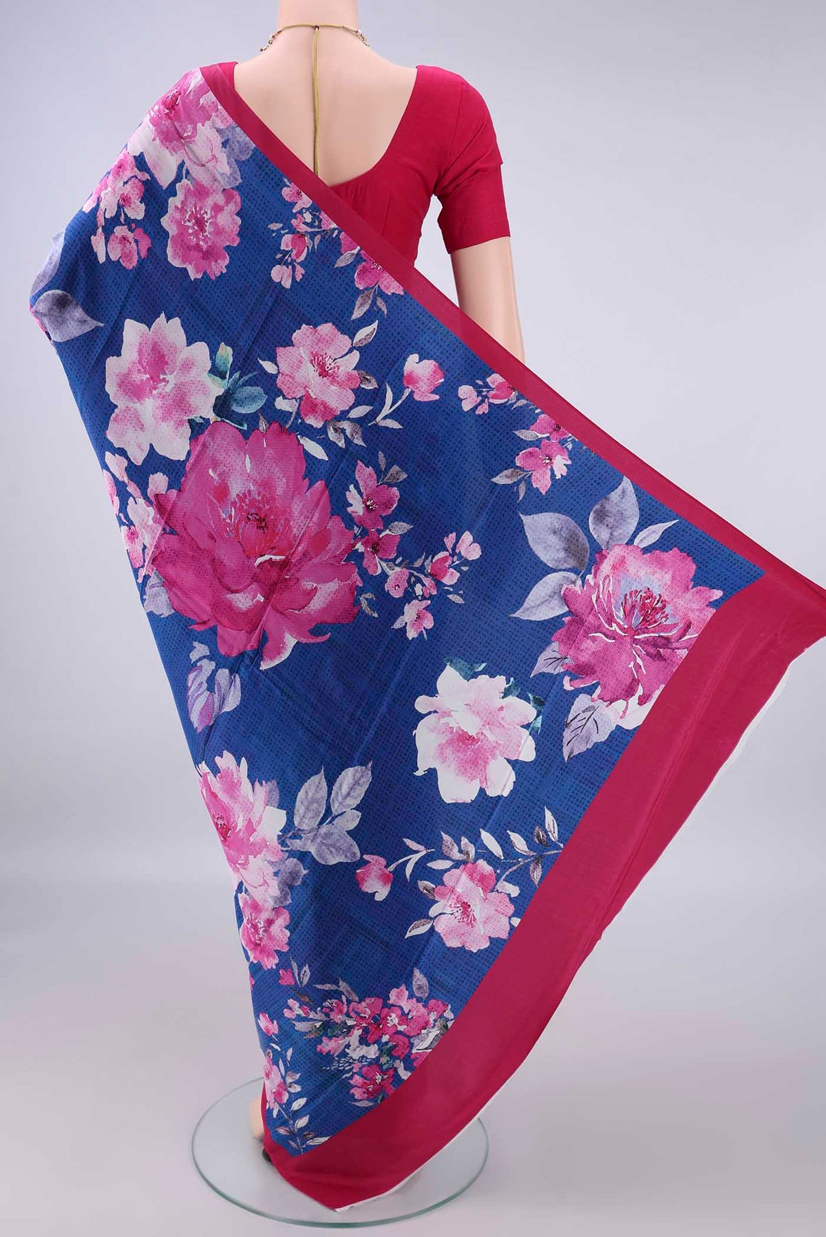 Flat view of Royal Blue Crepe Saree with Printed design on the body and Plain Border. 