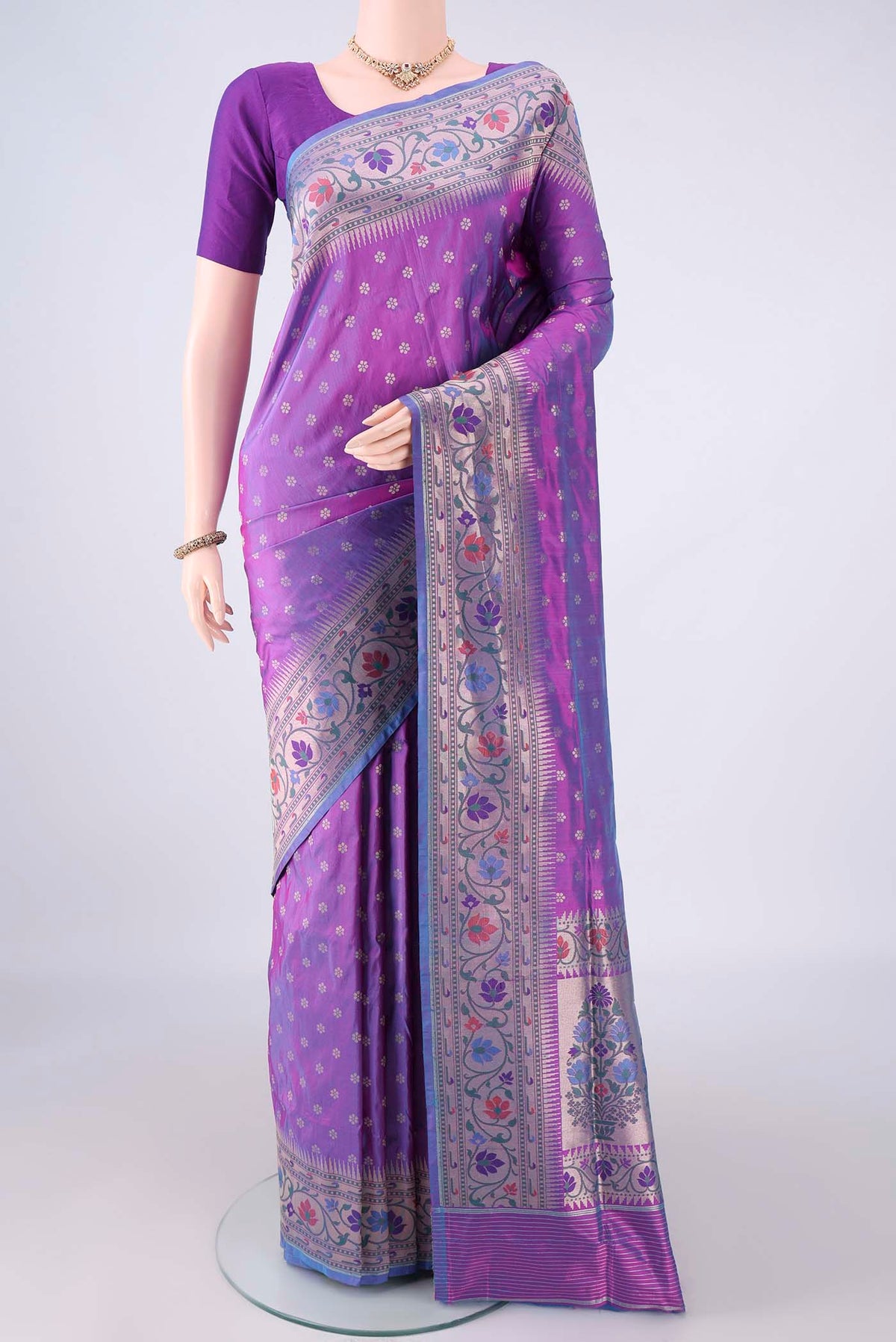 Pure Silk Purple Banarasi Saree with Zari Butta on the body and Meenakari Border.  displayed on a mannequin